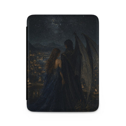 Fantasy illustration of a winged figure and woman overlooking a city at night.