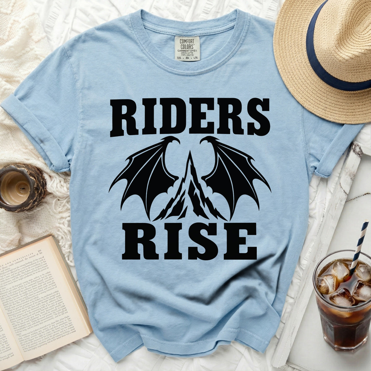 Light blue t-shirt with "RIDERS RISE" and dragon wings graphic.