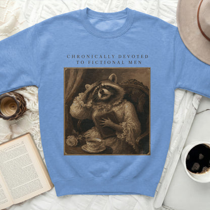 Sweatshirt with raccoon in antique style reading a book and text "Chronically Devoted to Fictional Men".