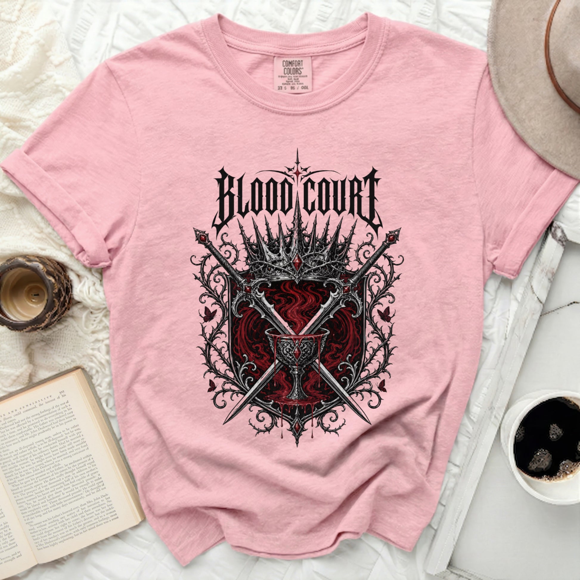 Pink t-shirt with "Blood Court" text and crown graphic.