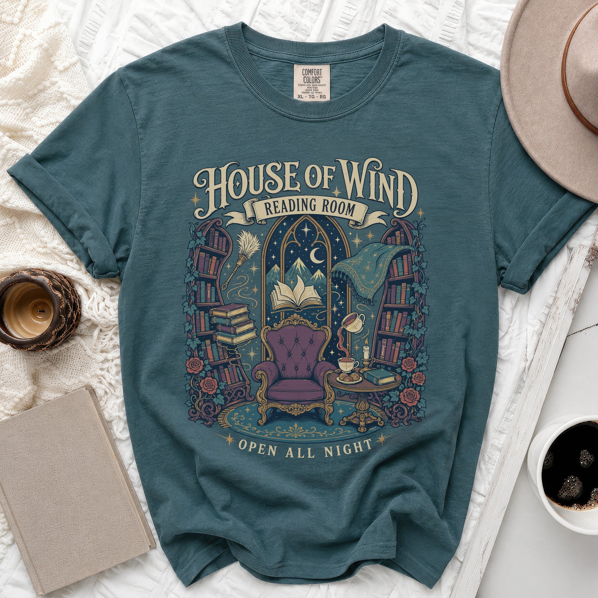 Teal t-shirt with "House of Wind Reading Room" design and open all night text.