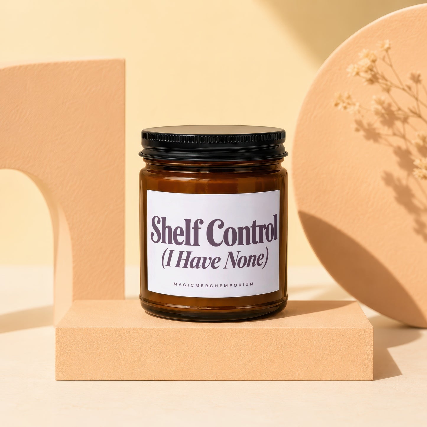 Amber jar candle with black lid, labeled "Shelf Control".