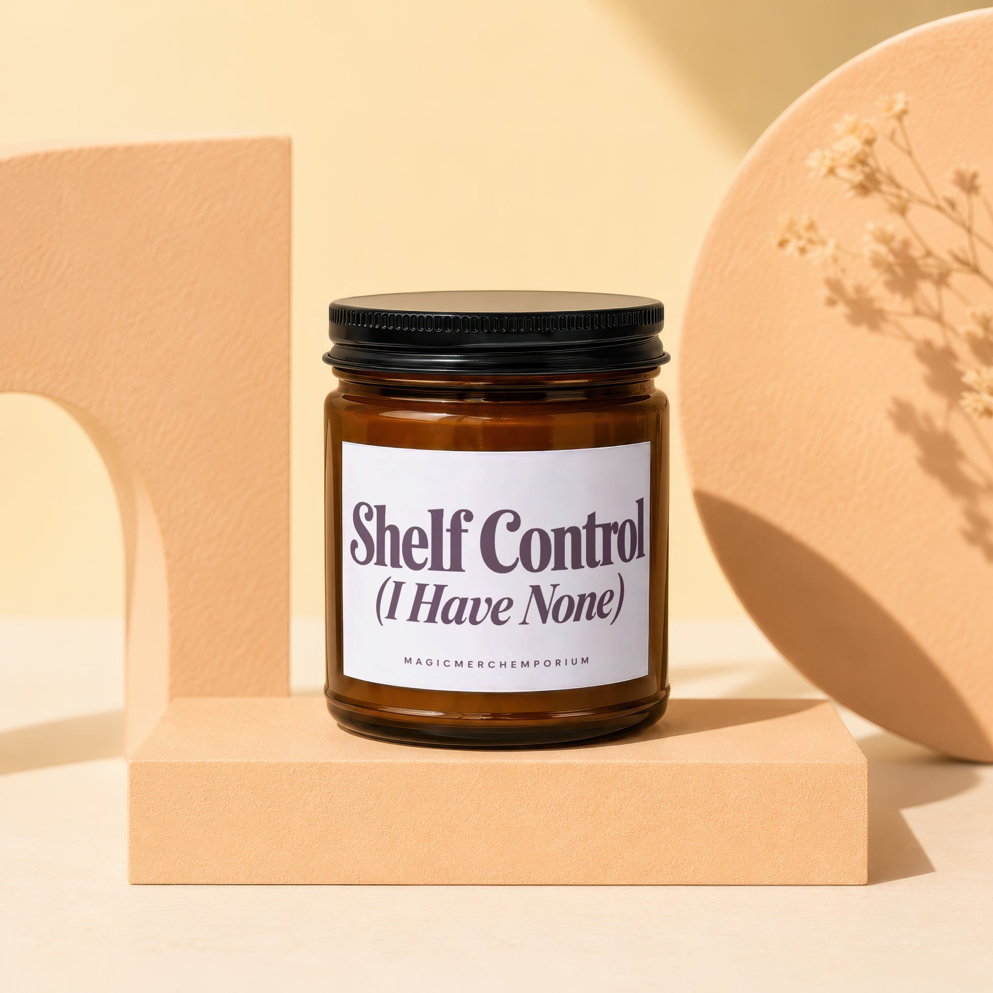 Amber jar candle with black lid, labeled "Shelf Control".