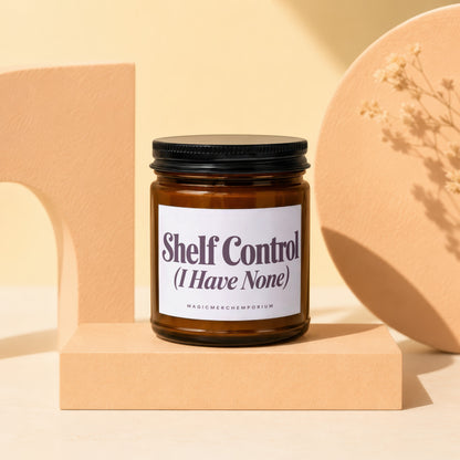 Amber jar candle with black lid, labeled "Shelf Control".
