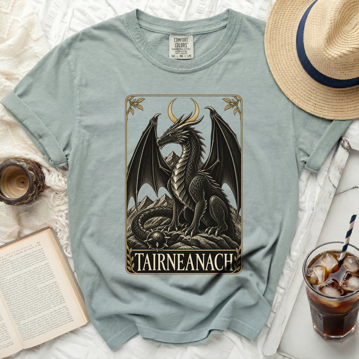 T-shirt with a black dragon design and the text "TAIRNEANACH" below.