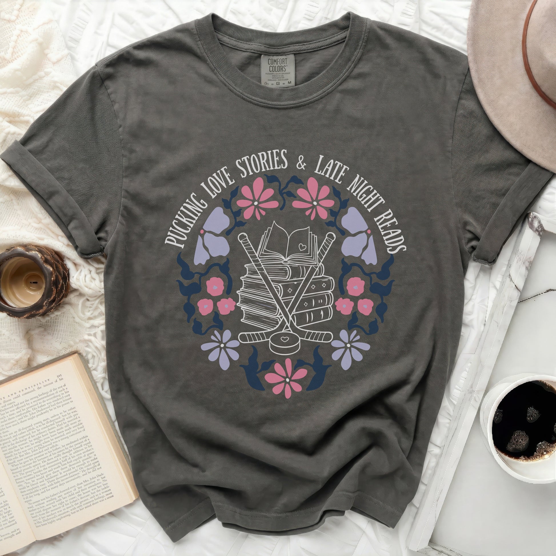 Dark grey t-shirt with "Pucking Love Stories & Late Night Reads" text and hockey graphic.