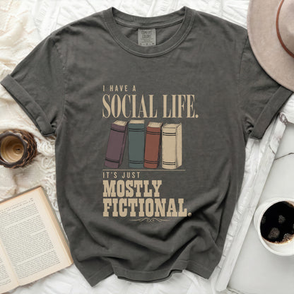 Dark grey t-shirt with "I Have a Social Life. It's Just Mostly Fictional" text.
