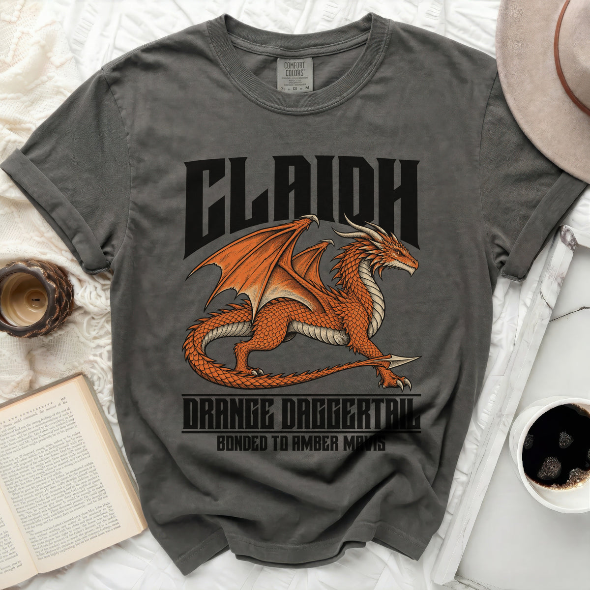 Gray t-shirt with orange dragon graphic and text "CLAIDH" and "ORANGE DAGGERTAIL".