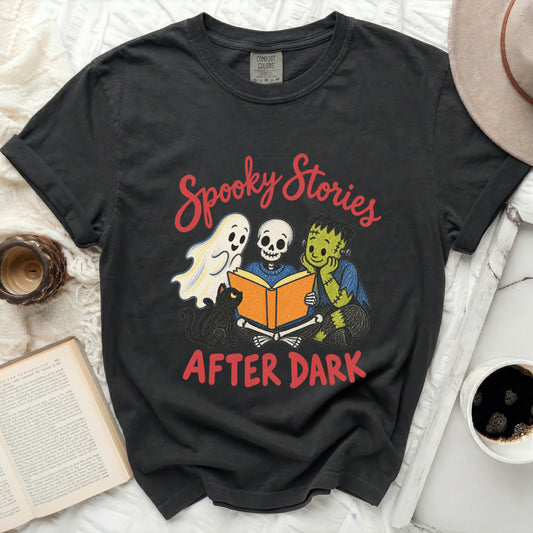 Black t-shirt with "Spooky Stories After Dark" and Halloween characters reading a book.