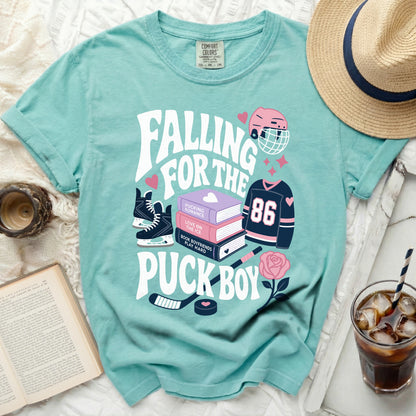 Mint green t-shirt with "Falling For The Puck Boy" text and hockey graphics.