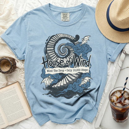 Light blue t-shirt with "House of Wind" graphic featuring stairs and dragons.