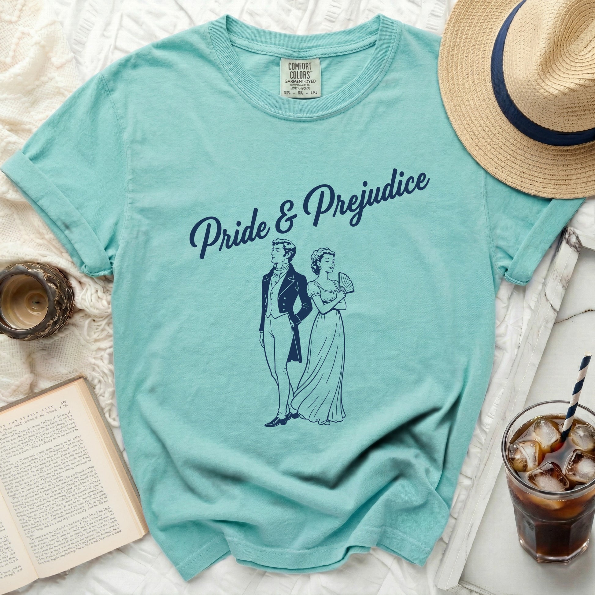 Teal t-shirt with "Pride & Prejudice" and a couple illustration.
