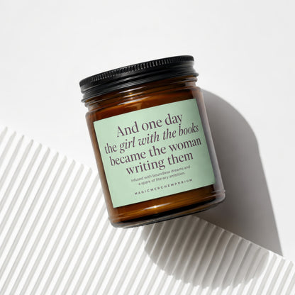 Amber jar candle with light green label featuring a quote and text.