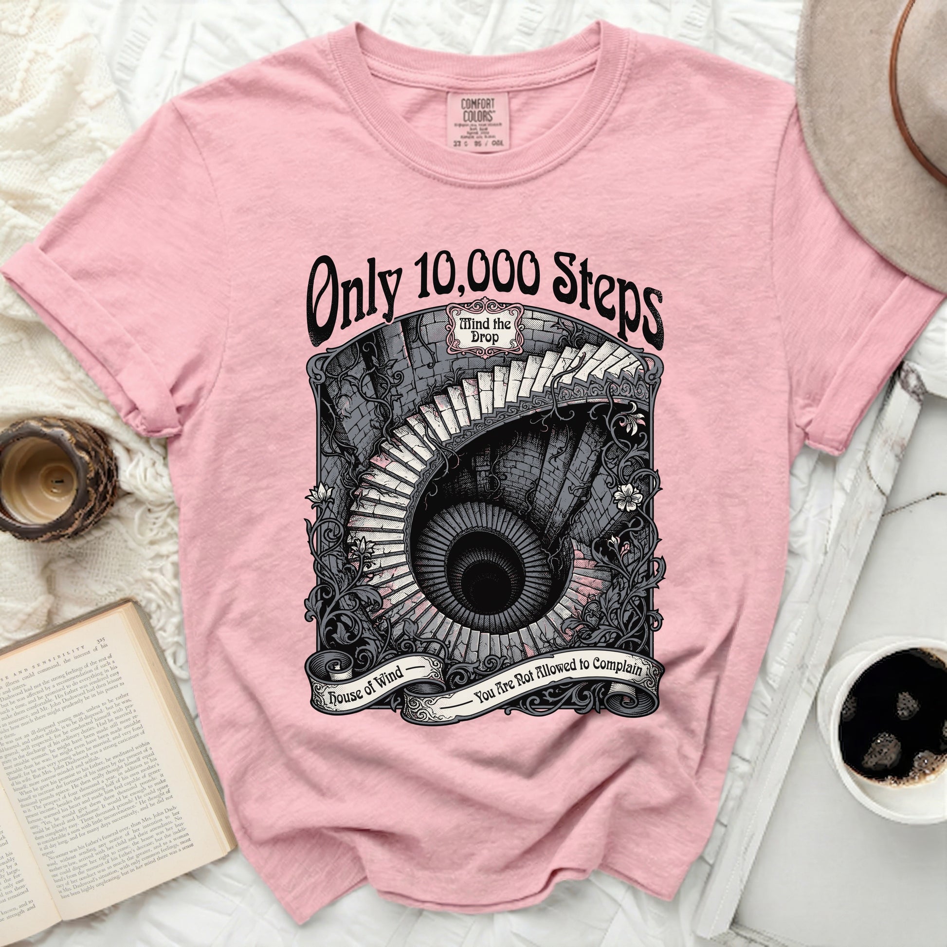 Pink t-shirt with "Only 10,000 Steps" and a spiral staircase graphic.