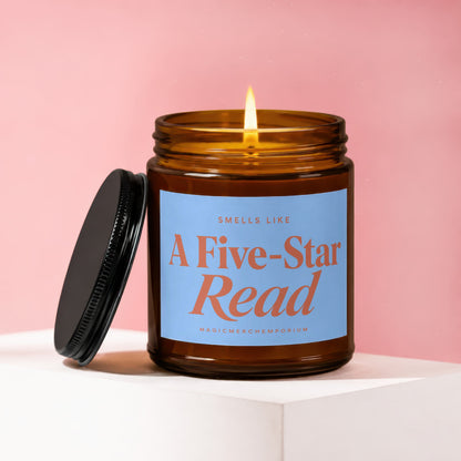 Amber glass candle with lit flame and blue label reading "A Five-Star Read."