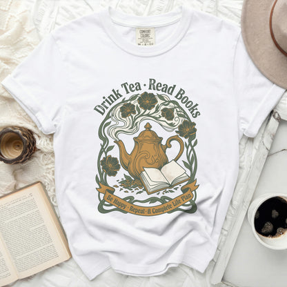 White t-shirt with "Drink Tea. Read Books" graphic and floral teapot.