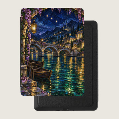 Stained glass style art of a bridge over water with boats and a castle town at night.
