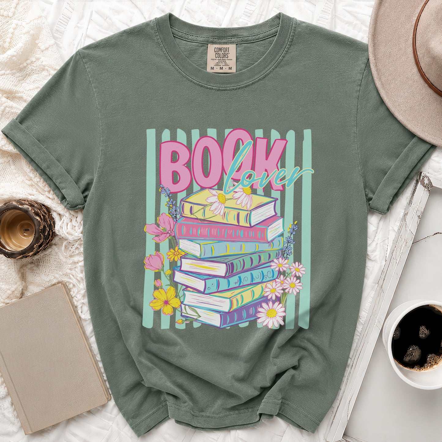Green t-shirt with colorful stack of books and "Book lover" text.