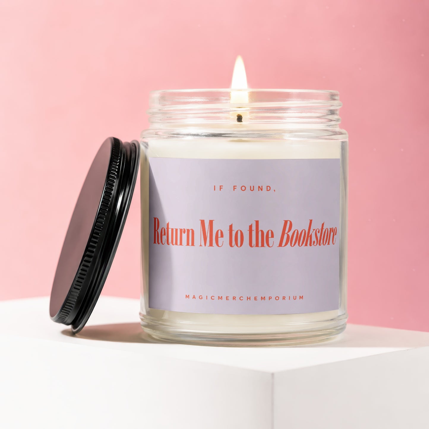 Candle with label "IF FOUND, Return Me to the Bookstore" and "MAGICMERCHMPORIUM".