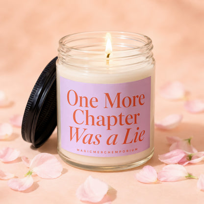 Candle with lid off, reads "One More Chapter Was a Lie" and "MagicMerchEmporium."