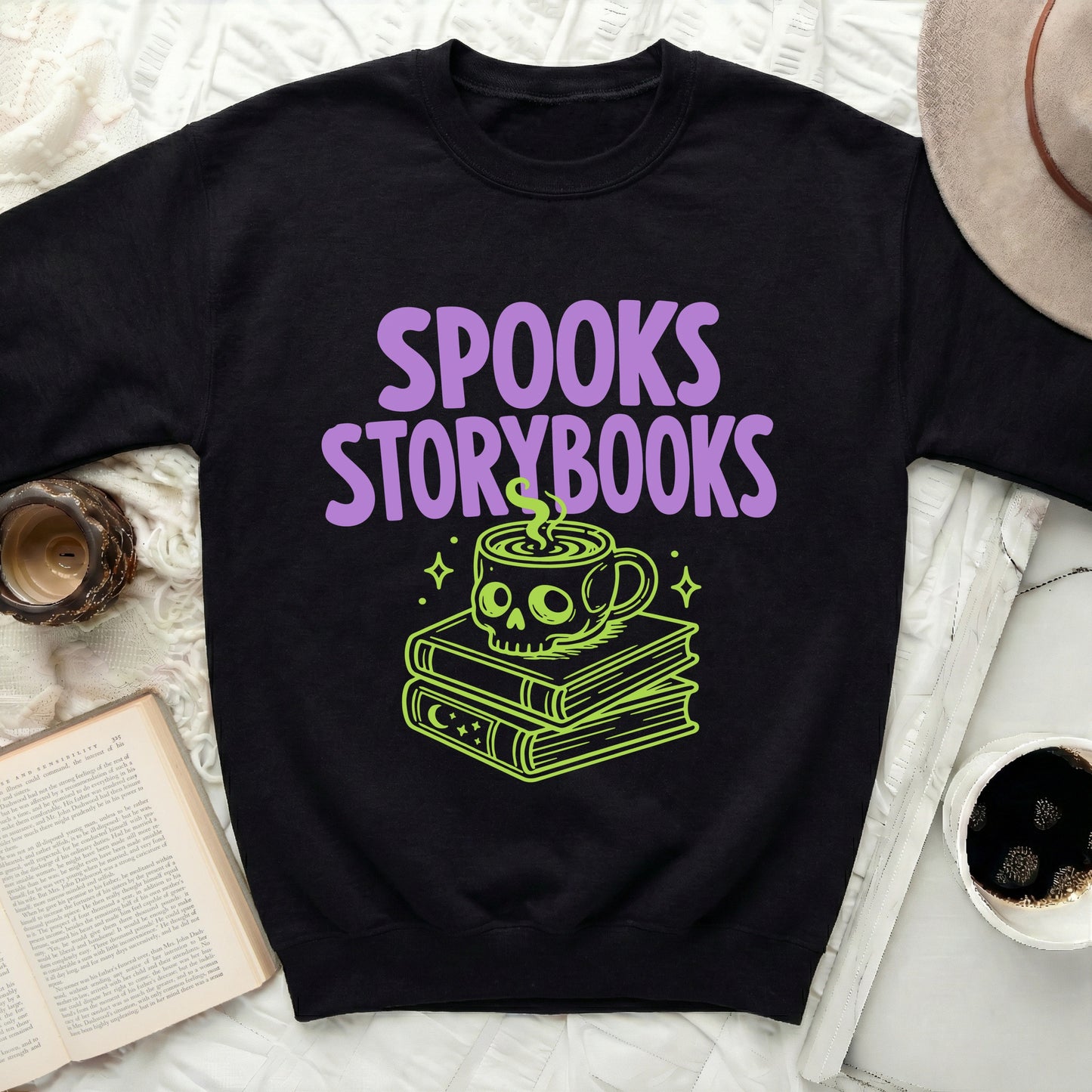 Black sweatshirt with "SPOOKS STORYBOOKS" and skull coffee cup design.