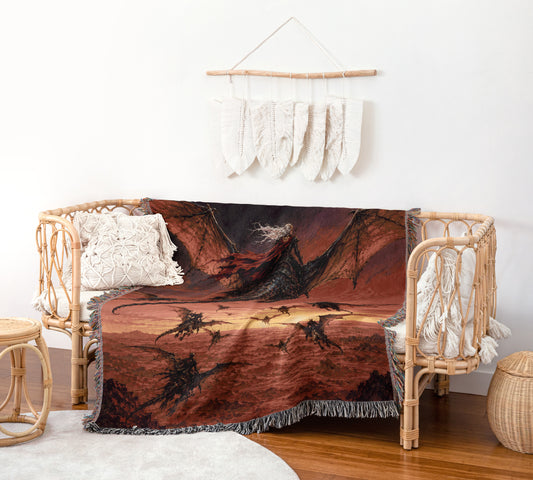 a cozy living room with a woven bench and a dragon-themed throw blanket draped over it. The blanket has a striking red and black dragon design, and it is hanging on a wall with white feathers. The room also includes a woven stool and a woven basket, adding to the rustic and comfortable atmosphere.