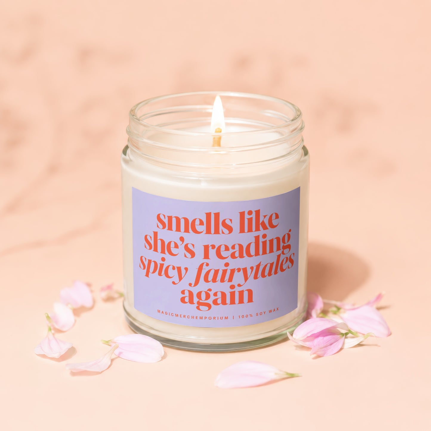 Candle with lavender label reading "smells like she's reading spicy fairytales again."