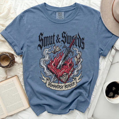 Blue t-shirt with "Smut & Swords" and "Romantasy Reader" graphic.