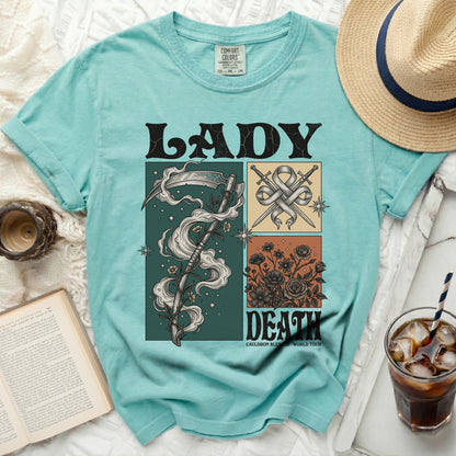Teal t-shirt with "LADY DEATH" graphic featuring grim reaper and flowers.