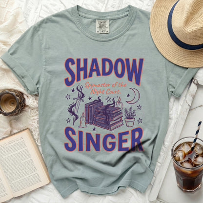 Shadow Spymaster of the Night Court t-shirt with sword and books graphic.