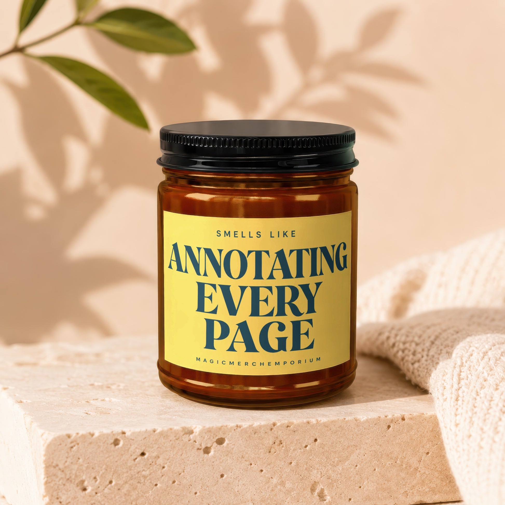 Amber jar candle with "Smells Like Annotating Every Page" text on a yellow label.