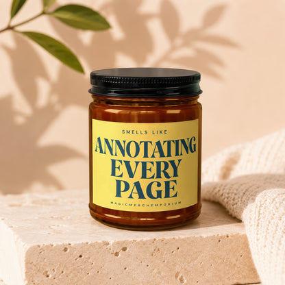 Amber jar candle with "Smells Like Annotating Every Page" text on a yellow label.