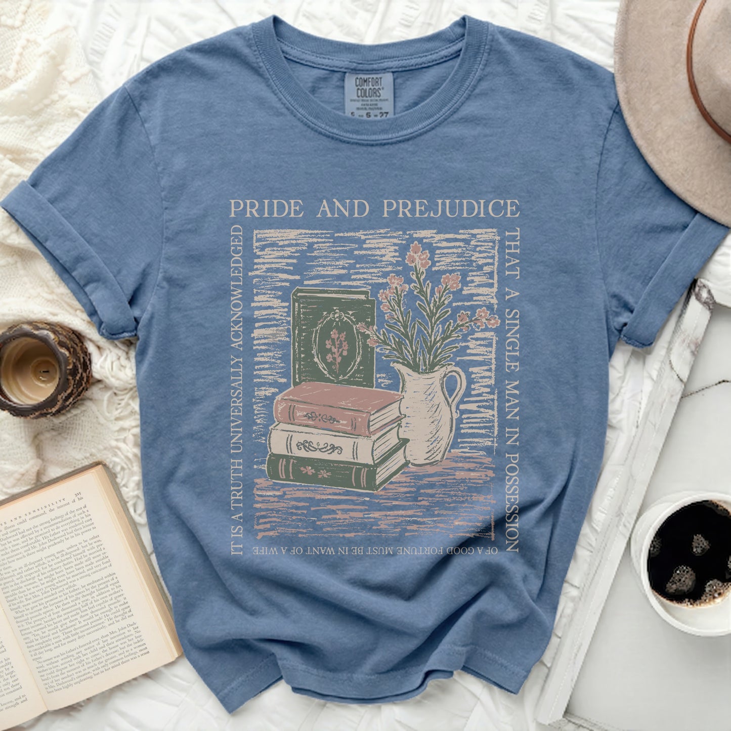 Blue t-shirt with Pride and Prejudice quote and book illustration.