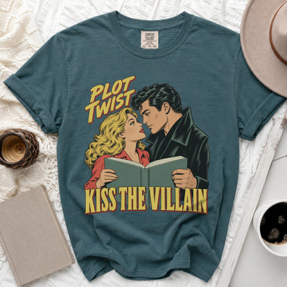 Teal t-shirt with comic book art of a couple reading and text "Plot Twist Kiss the Villain."
