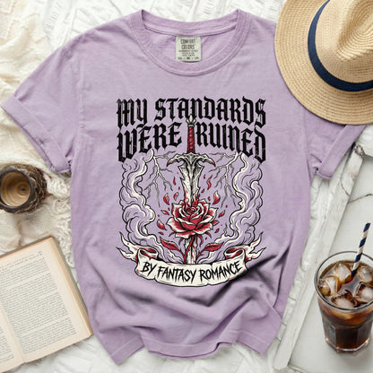 Purple t-shirt with graphic "My standards were ruined by fantasy romance".