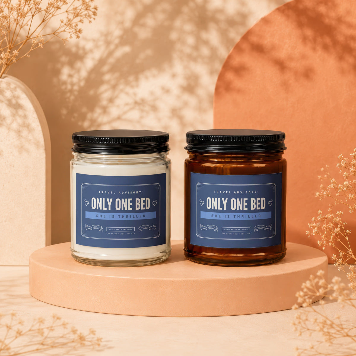 Two soy wax blend candles with "Only One Bed" labels on pedestals.