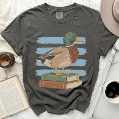 Duck on stacked books graphic t-shirt with blue stripes.