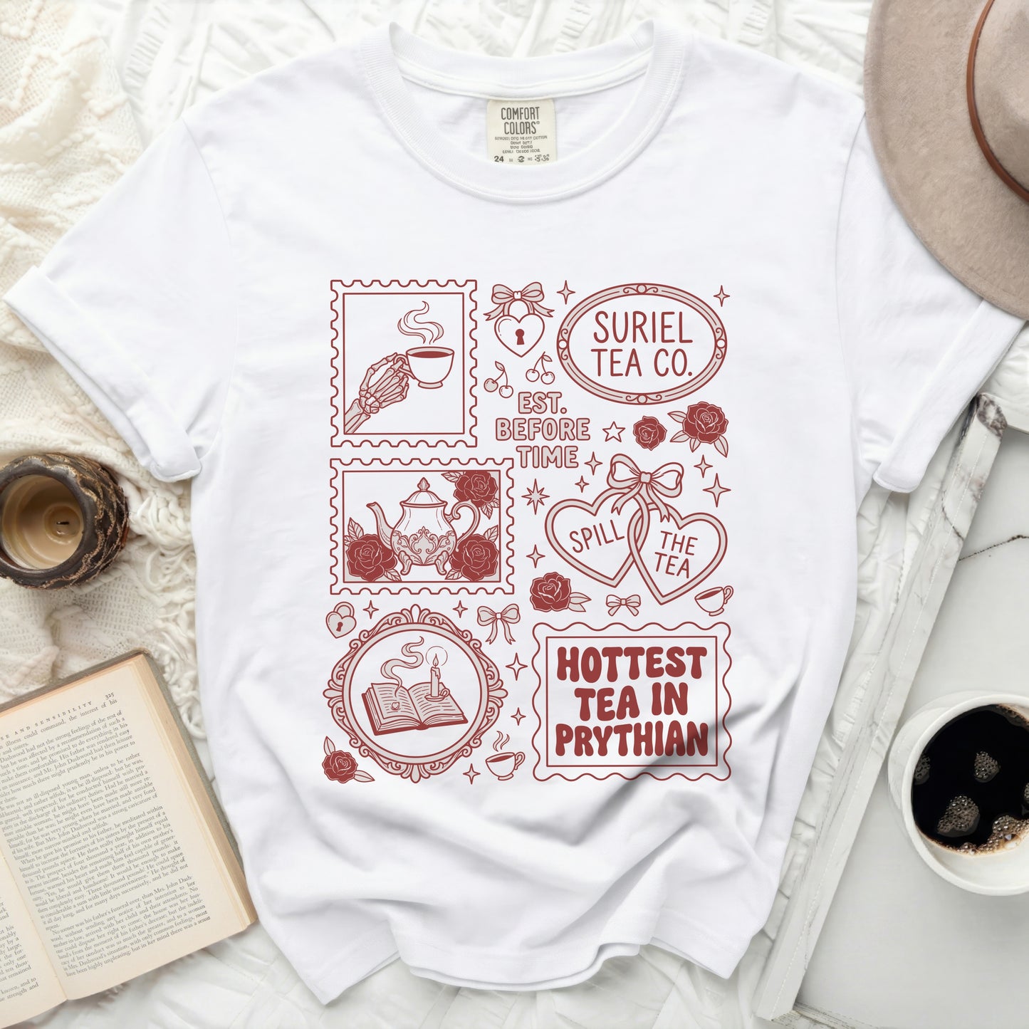 White Comfort Colors t-shirt with Suriel Tea Co. and other graphic elements.