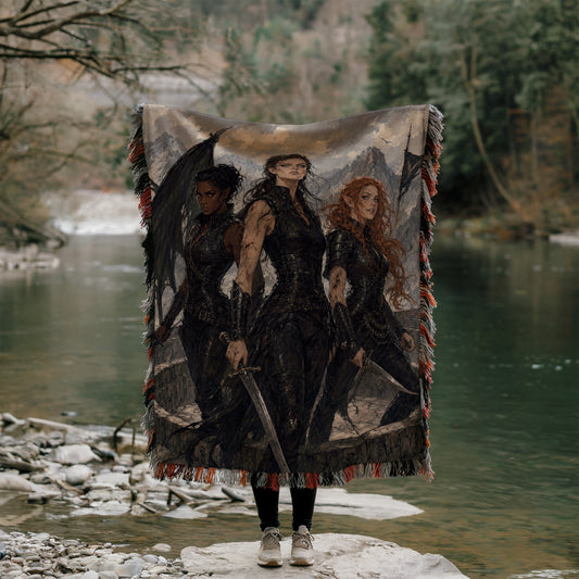 A person is standing in front of a large tapestry depicting three women, holding a sword and wearing dark clothing.