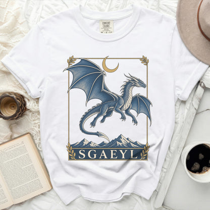 White t-shirt with a blue dragon graphic and the text "SGAEYL".