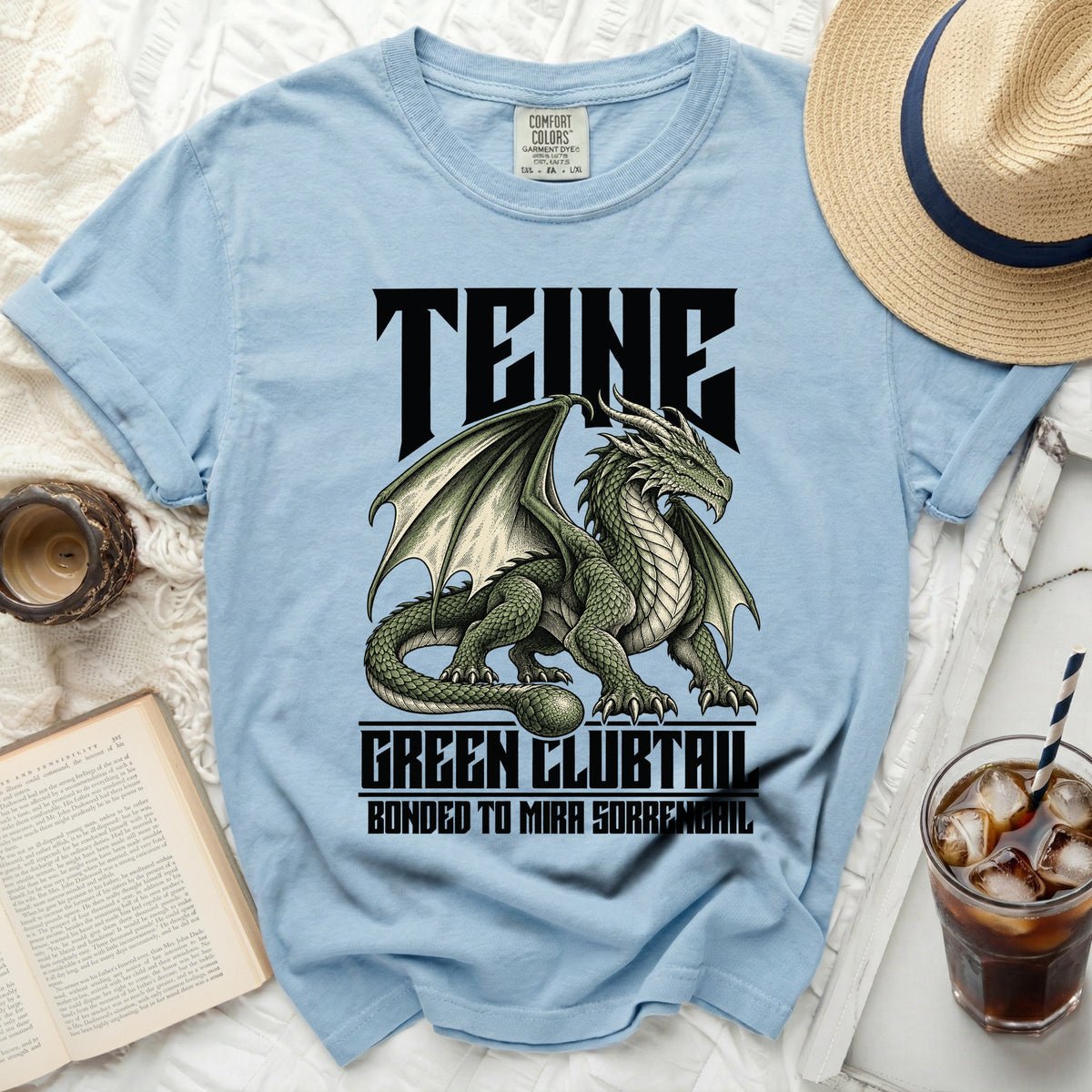 Light blue t-shirt with a green dragon graphic and text "TEINE GREEN CLUBTAIL BONDED TO MIRA SORRENGAIL".