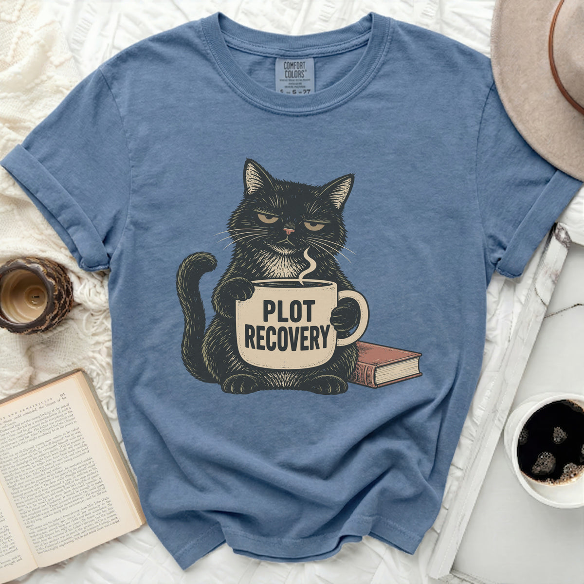 T-shirt with a black cat holding a mug that says "PLOT RECOVERY".