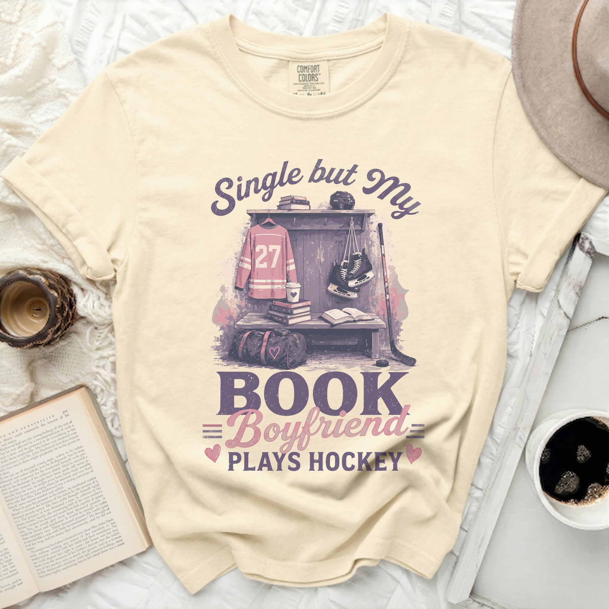 T-shirt with "Single but My Boyfriend Plays Hockey" graphic.