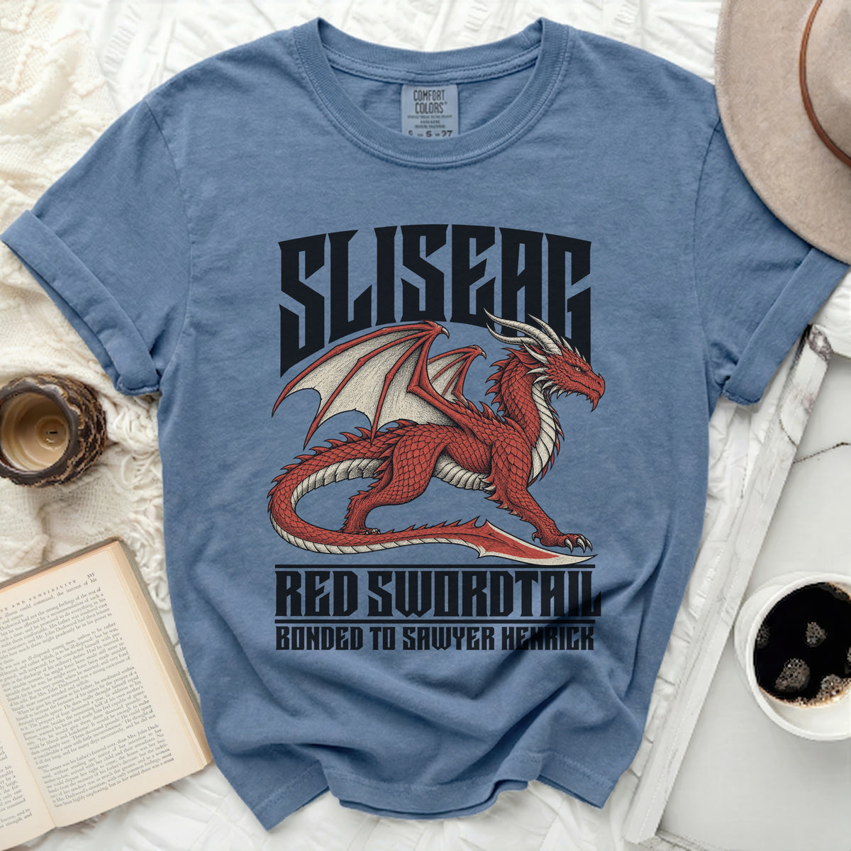 Blue t-shirt with red dragon art and text "SLISEAE RED SWORDTAIL BONDED TO SAWYER HENRICK".
