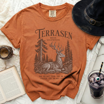 Orange t-shirt with Terrasen House Galathynius graphic, deer, trees, and quote.