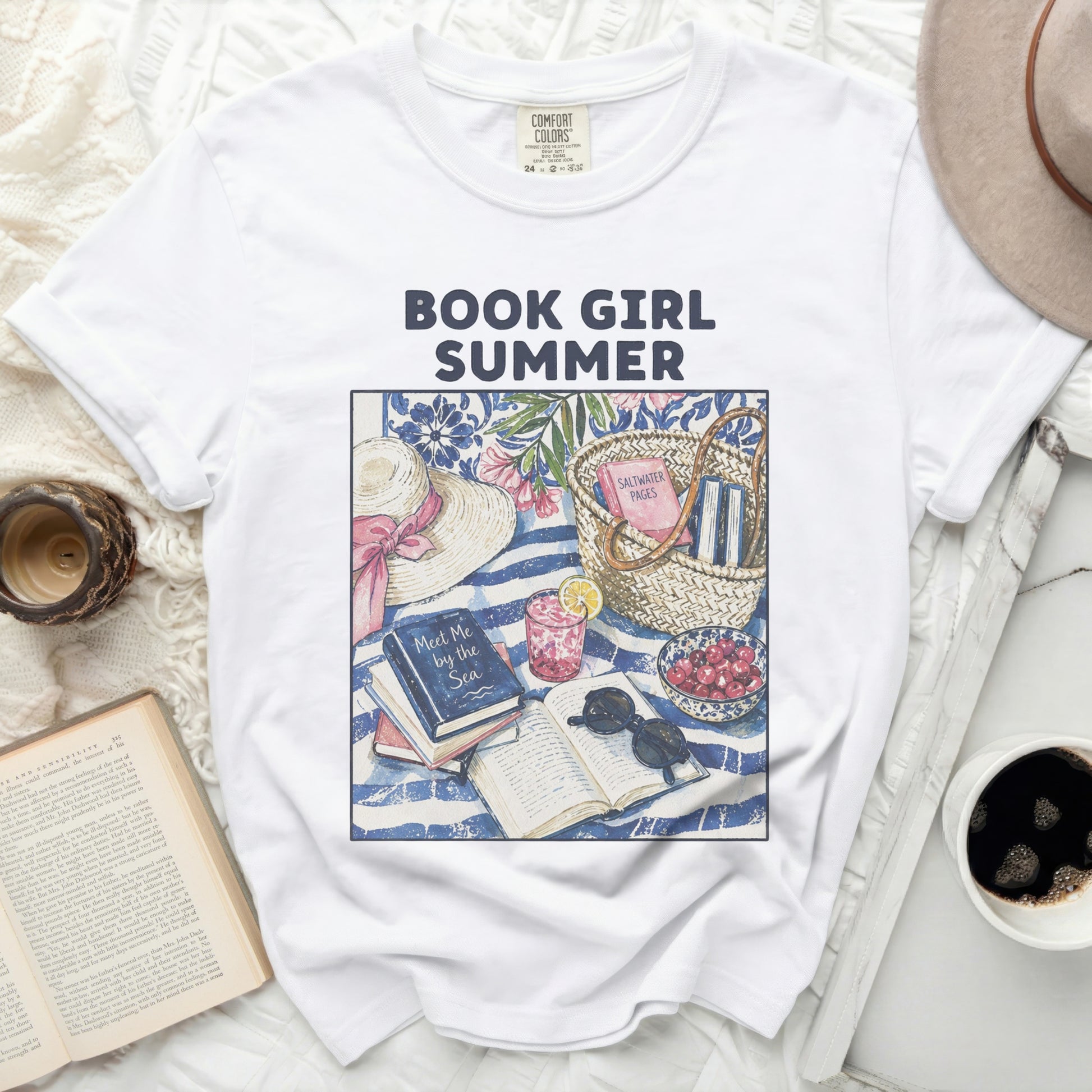 White t-shirt with "Book Girl Summer" graphic of beach items and books.
