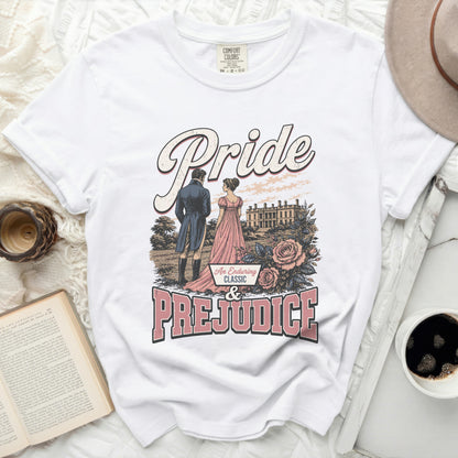 White t-shirt with "Pride & Prejudice" graphic featuring a couple and mansion.