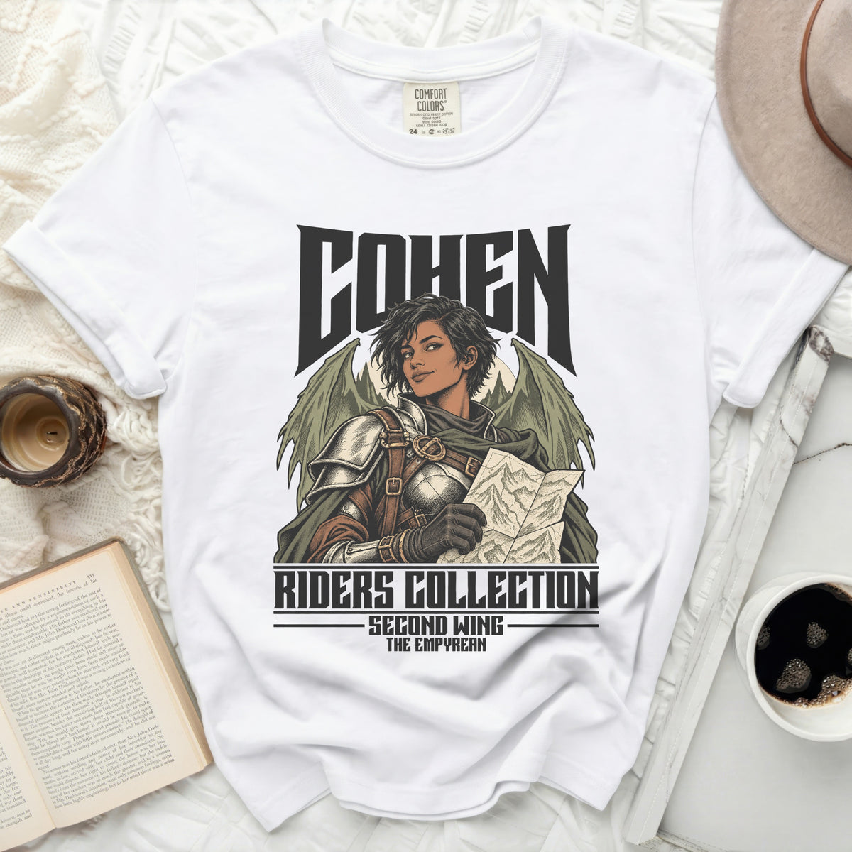 White t-shirt featuring "COHEN RIDERS COLLECTION SECOND WING THE EMPYREAN" text and dragon-winged character.