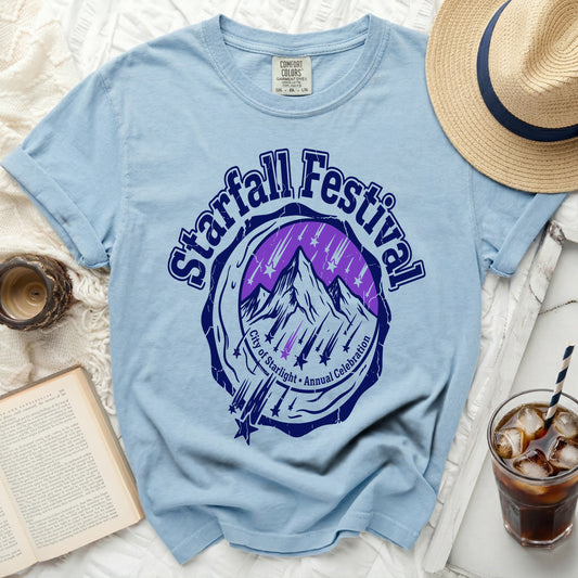 Light blue t-shirt with "Starfall Festival City of Starlight Annual Celebration" graphic.