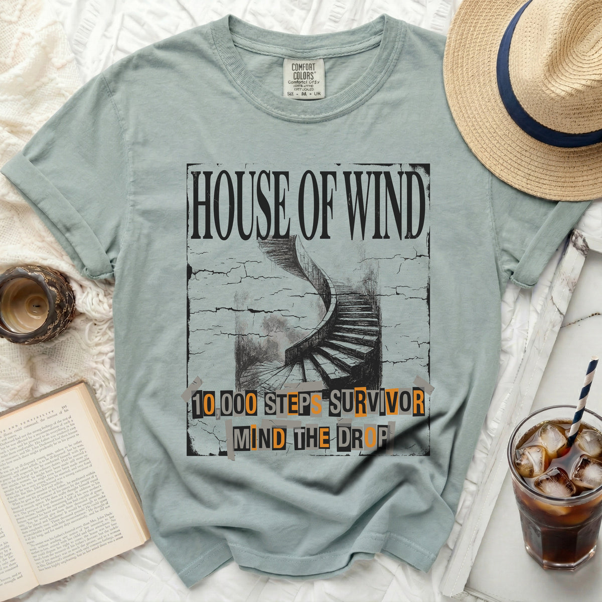 "House of Wind" t-shirt with spiral staircase and text "10,000 Steps Survivor Mind the Drop".